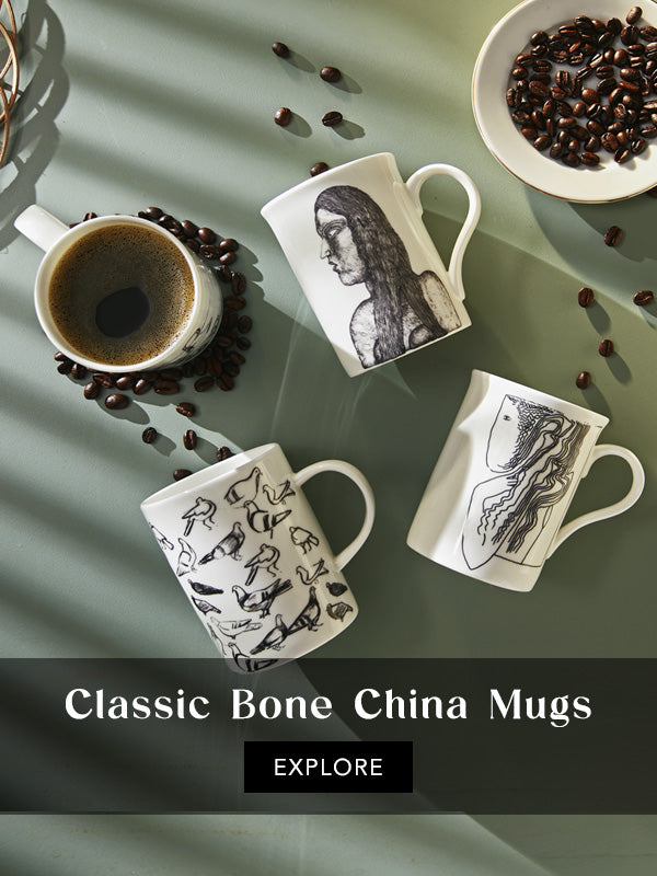 Top shot of art-inspired mugs including N.N Mohandas's pigeons and Prabhakar Barwe's girl 