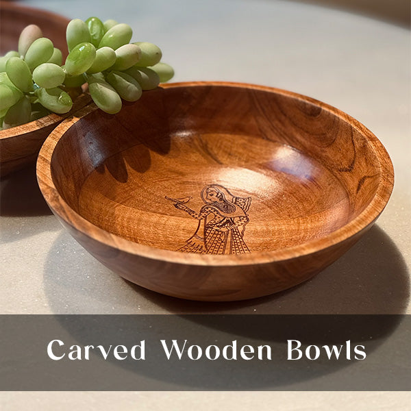 Carved wooden bowl featuring Madan Meena's Aghan